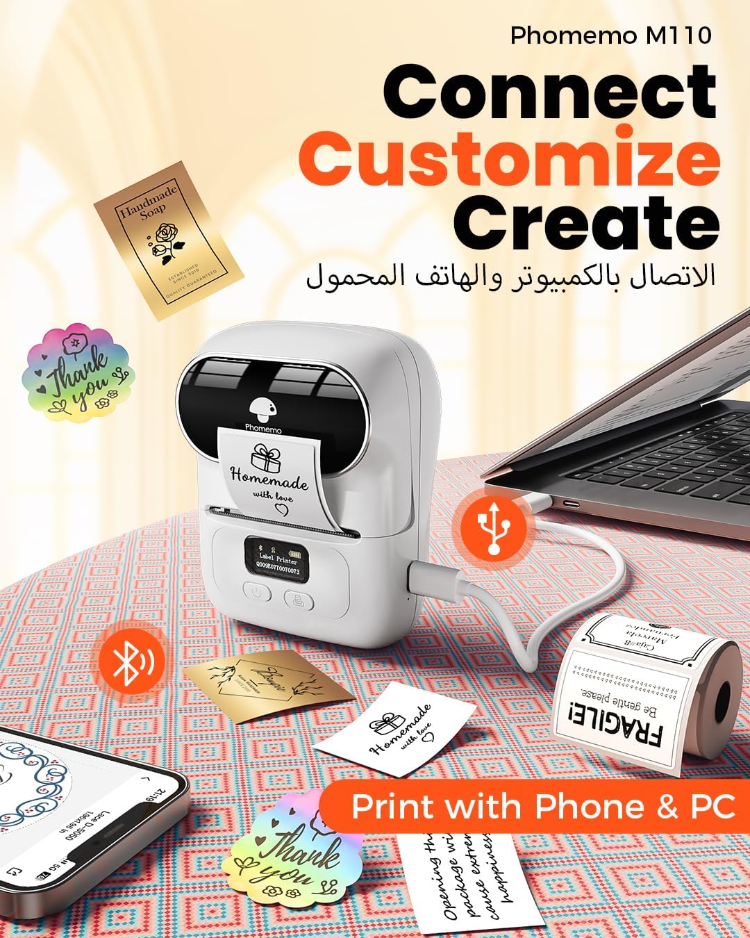 Phomemo M110 label printer with smartphone, laptop, and printed labels on a patterned surface.