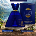 A perfume advertisement for 'it is' Eau de Parfum, showing a dark blue geometric bottle and its matching box. The background depicts a scenic French landscape with a blue sky, mountains, and a stone path, with promotional text overlays and website details
